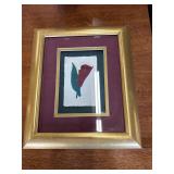 3-D picture of a rose in a gold frame