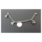 Charm Bracelet with Bell, Binoculars, and 99 Charm