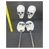4 Vintage Sidewalk Skull Heads