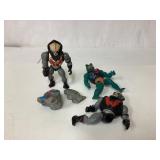 Action Figures, One Missing a Leg