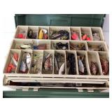 Green Tackle Box Crammed with Fishing Lures and Ac