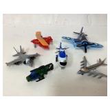 Six Toy Airplanes and Helicopters