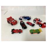 Seven Toy Race Cars in Various Styles and Colors
