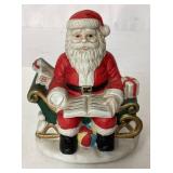Santa Claus Figurine Sitting on Sleigh with Gifts