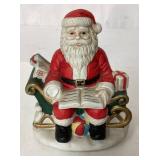 Santa Claus Figurine Sitting on Sleigh with Gifts