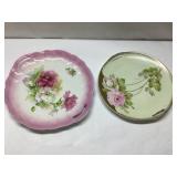 Two Decorative Handled Plates with Floral Motif