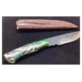 Handcrafted Knife with Textured Blade and Leather