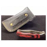 Folding Knife with Red Handle and Black Leather Sh