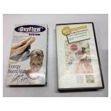 Two VHS Tapes: OxyFlow Energy Boost and Cake Decor