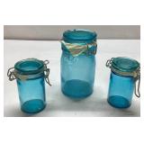 Three Blue Glass Canisters With Wire Clamps