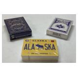 3 Unopened Decks of Playing Cards Featuring Varied