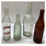 Four Vintage Glass Bottles Including Sun-Rise Beve