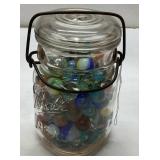 Vintage Jar Containing Unchecked Marbles With Wire
