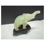 Carved Jade Elephant Figurine on Wooden Stand