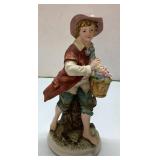 Porcelain Figurine of a Boy Holding a Basket of Fl