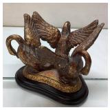 Gold-Toned Sculpture of Three Swans on Black Base