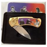 Gold-Tone Folding Knife Featuring Iconic Music Fig