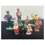 Eight Painted Cast Iron Figurines in Various Desig