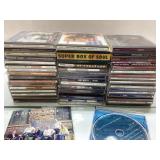 50 Mixed CDs Spanning Various Genres