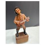 Hand-Carved Wooden Figurine of Musician Playing Gu