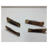 Four Folding Knives with Brass and Wood Handles