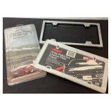 Two License Plate Frames with Packaging