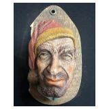 Hand-Carved and Painted Wooden Wall Plaque Featuri