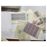 Stamps in Blue Plastic Storage Box