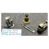 Four Metal Figurines Featuring Train and Bell Moti