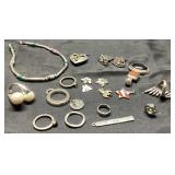 Jewelry Lot Featuring Rings, Brooches, and Necklac