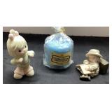 Two Ceramic Figurines with Blue Candle