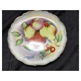 Four Decorative Plates Featuring Fruit and Hot Air