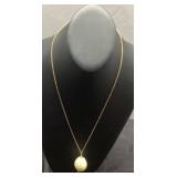Gold-Toned Necklace with Painted Egg-Shaped Pendan