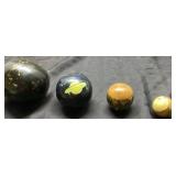 Four Decorative Spheres in Display Case