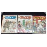 Three Cracked Magazines with Protective Sleeves
