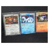 Three Pokemon Trading Cards: Heatran, Chien-Pao, a