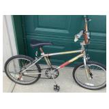 Redline BMX Bicycle with Rusted Frame and Wear