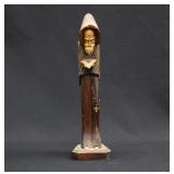 vintage hand-carved wooden statue of a monk