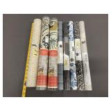 8 New/Used Various Brand Rolls Of Wallpaper