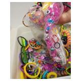 Bucket of hair ties and beads