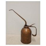 Vintage eagle oil can with oil in it. Os