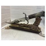 Wolf Knife w display foot on stand needs repair