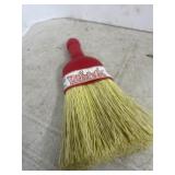 plastic-handled whisk broom