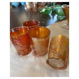 4 Carnival Glass Tumblers. 1 Chipped