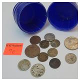 plastic blue barrel with old mixed change