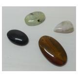 Four Polished Gemstone Cabochons