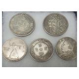 Five Chinese Coins Featuring Dragons, Egyptian Imagery, and Chinese Script..about the size of silver dollar ..these coins are not silver