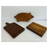 Group of Wooden Cutting Boards Including Pig Shape