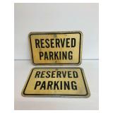 Two Reserved Parking Signs