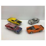 Four Diecast Model Cars: Ford Shelby, Dodge Charger, and More